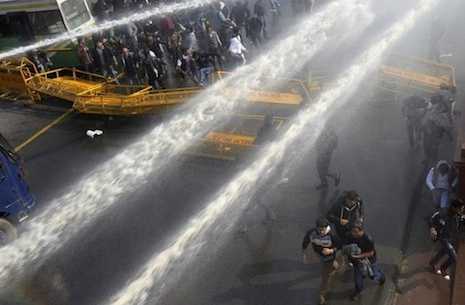 Police use teargas, water to disperse rape protesters