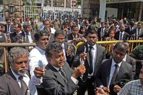 Ousted chief justice replaced amid protests