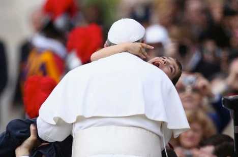 Pope's careful embrace for boy with cerebral palsy