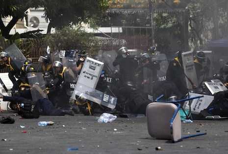 Thailand's PM to face charges as Bangkok clashes leave five dead