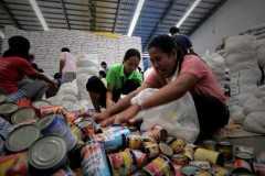 Aid for Philippines typhoon victims found rotting in dump