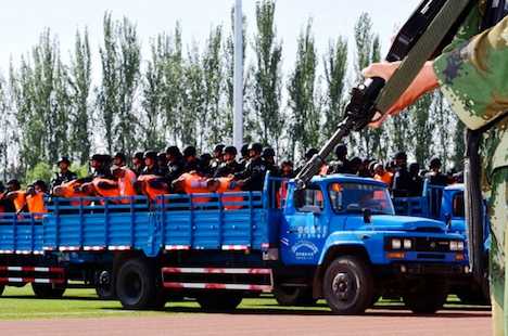 China sentences 55 people at Xinjiang show trial 