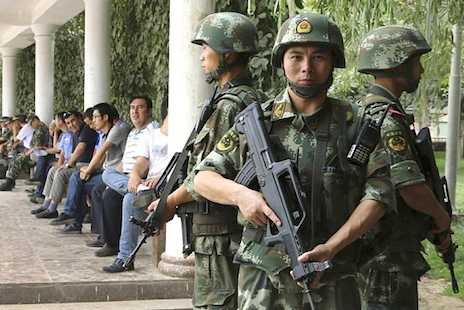 China's Xinjiang residents told to fight terror with a frown