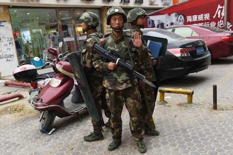 Xinjiang residents says China forces shot protesters