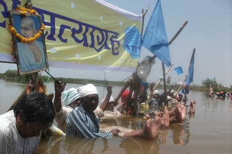 Indian villagers stand in water for weeks to protest dam policy