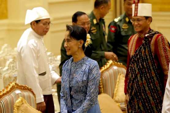Myanmar's Suu Kyi drops two cabinet posts 