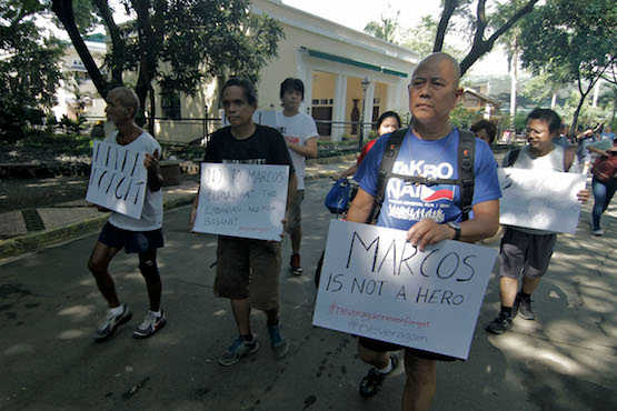 Filipino priest runs against hero's burial for Marcos