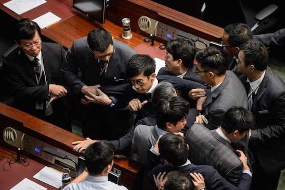 Hong Kong system under threat as Beijing blocks lawmakers 