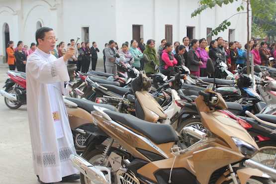 Vietnam Catholics have vehicles blessed on Lunar New Year