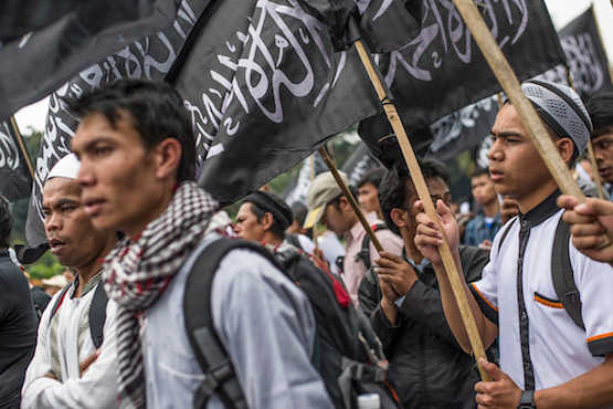 Militants, opposition unite to attack Indonesia's Widodo