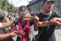 Condemnation as fists fly at Philippine strike dispersal