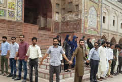 Never break the chain: Students ring mosques in Pakistan