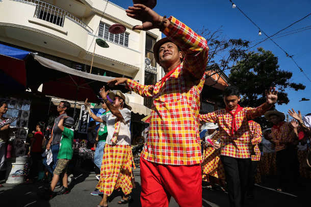 Philippine couples dance before Virgin Mary for children