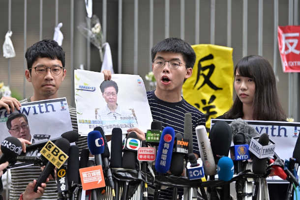 Police arrest three Hong Kong democracy activists