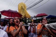 Filipino Catholics brave rain to celebrate Mary's birthday