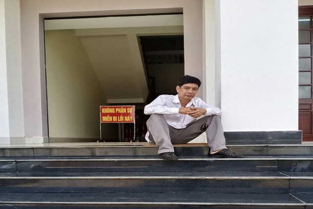 Vietnam court to reconsider case after farmer's suicide