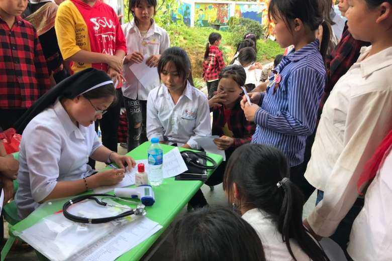 Missionary nuns help Hmong villagers in Vietnam