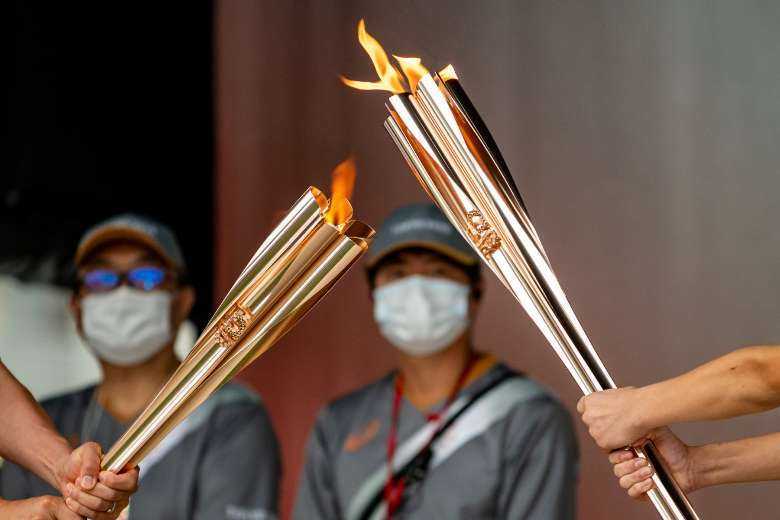 Olympic flame arrives in Tokyo after 'heartbreaking' fan ban