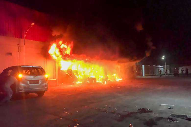 At least 18 dead after clash, fire at Indonesian club