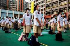China tightens grip on Hong Kong's education system 
