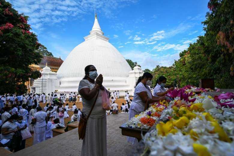 Sri Lankans celebrate Buddhist festival at protest site