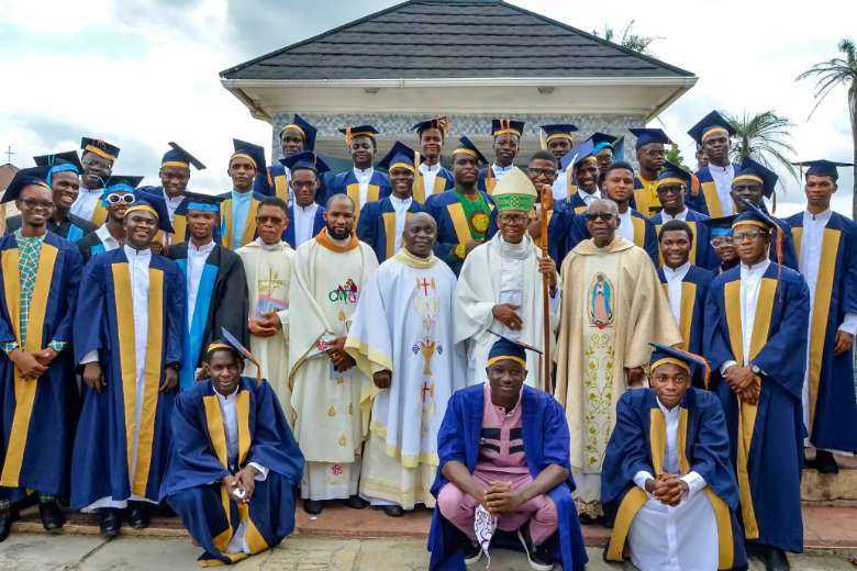 Archbishop Anthony Obinna with matriculating students and members of management after the ceremony at the Claretian University of Nigeria.