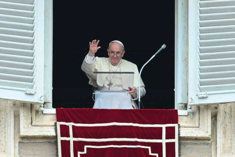 Pope Francis waves from the window of the apostolic palace overlooking St. Peter's Square as he leads the Regina Coeli prayer on May 29, 2022 in The Vatican