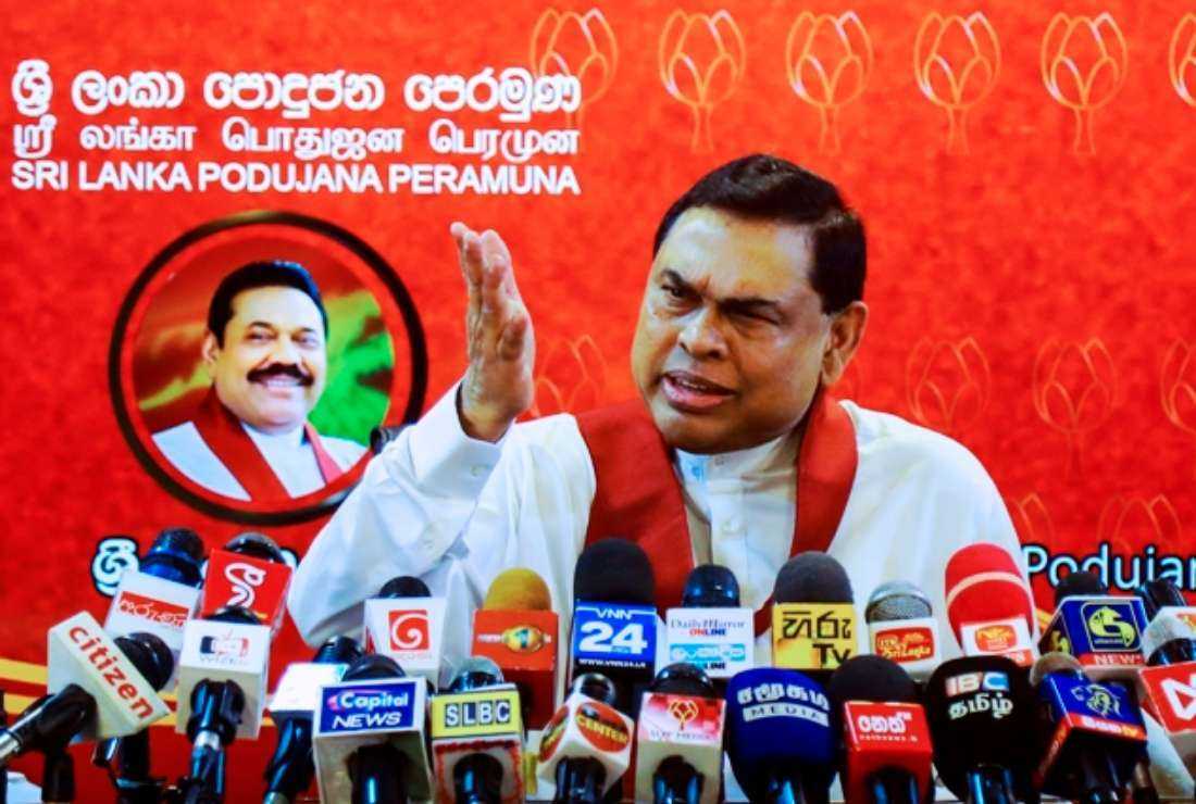Sri Lanka's former finance minister Basil Rajapaksa, younger brother of President Gotabaya Rajapaksa, speaks during a press conference to announce his resignation as an MP in Colombo on June 9