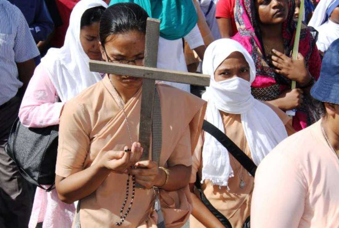 Indian Catholics pray during an annual rally on Palm Sunday in New Delhi, on April 4, 2017