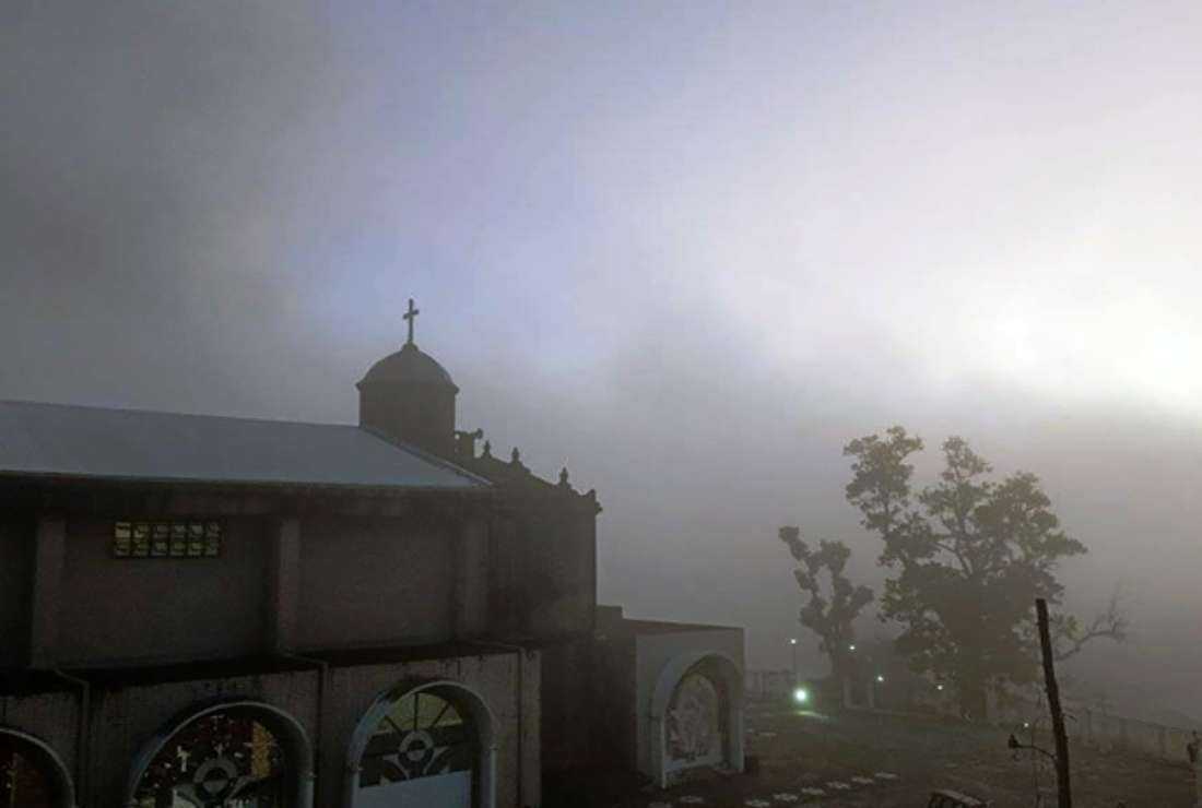 Ash from the eruption of Bulusan volcano engulfing a church in Irosin town, Sorsogon province, south of Manila, on June 12