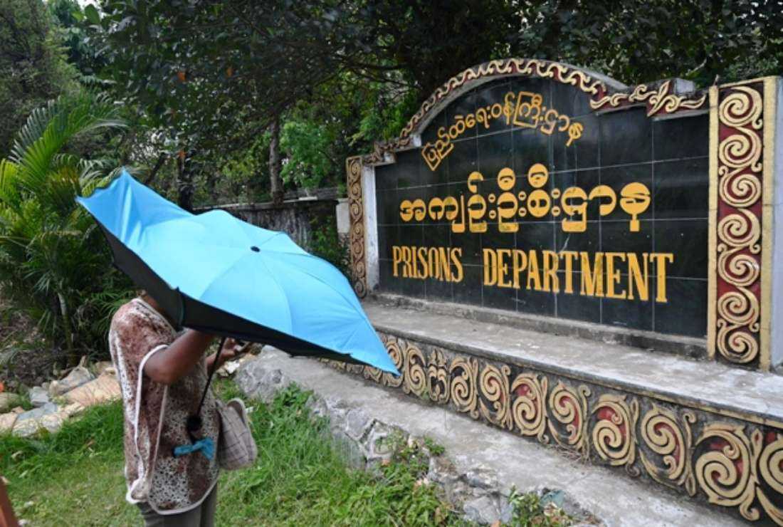 A relative waits for the release of prisoners in front of Insein Prison in Yangon, Myanmar, on April 17