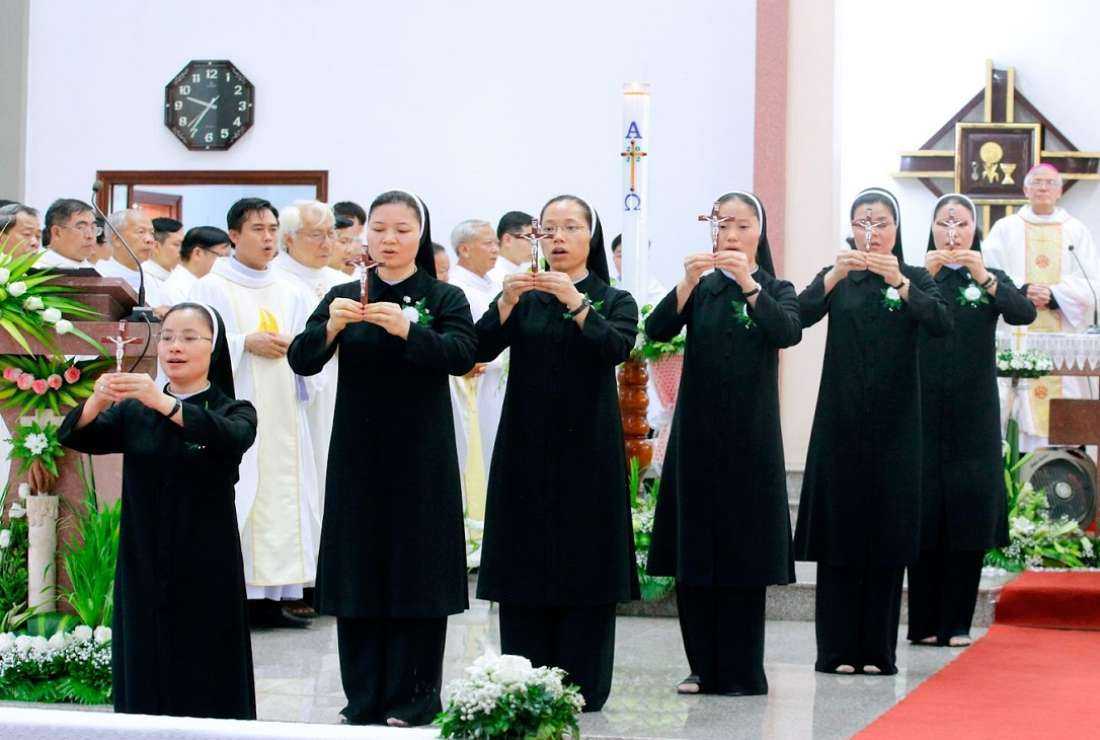 Sister Therese Nguyen Thi Giang (third left) and other sisters at their final vows ceremony on June 4 in Ninh Binh province