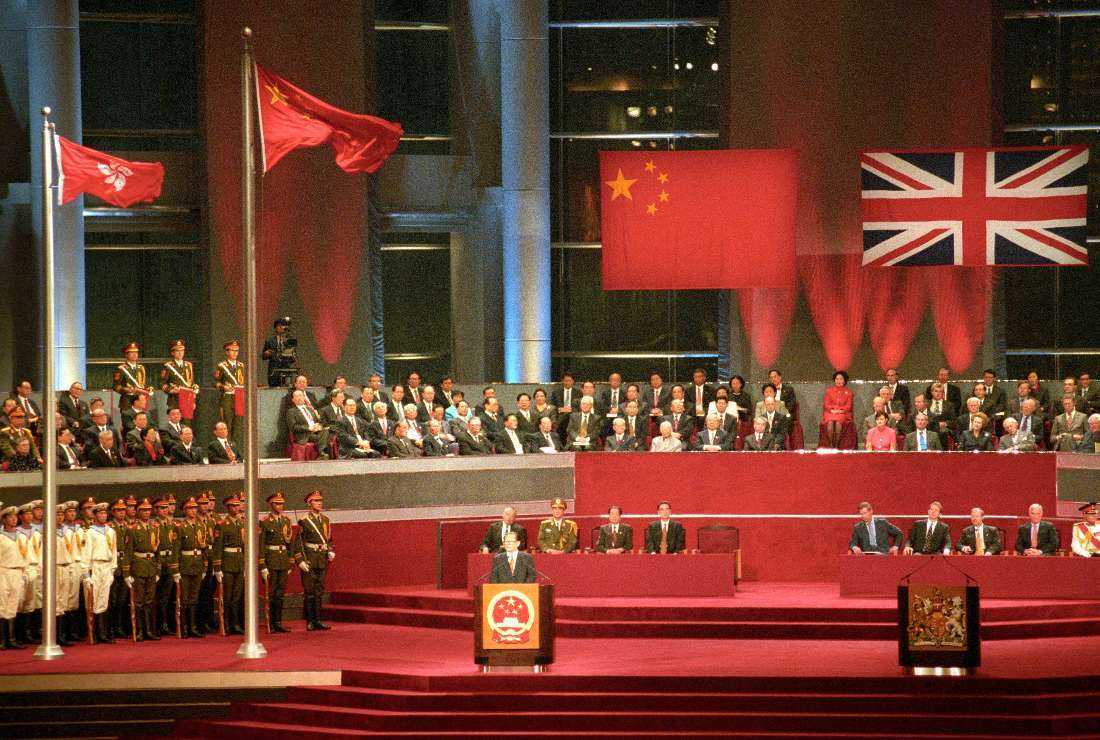 Chinese President Jiang Zemin addresses delegates after the raising of the Chinese and Hong Kong flags following the British colony's handover to Chinese rule at midnight on June 30, 1997