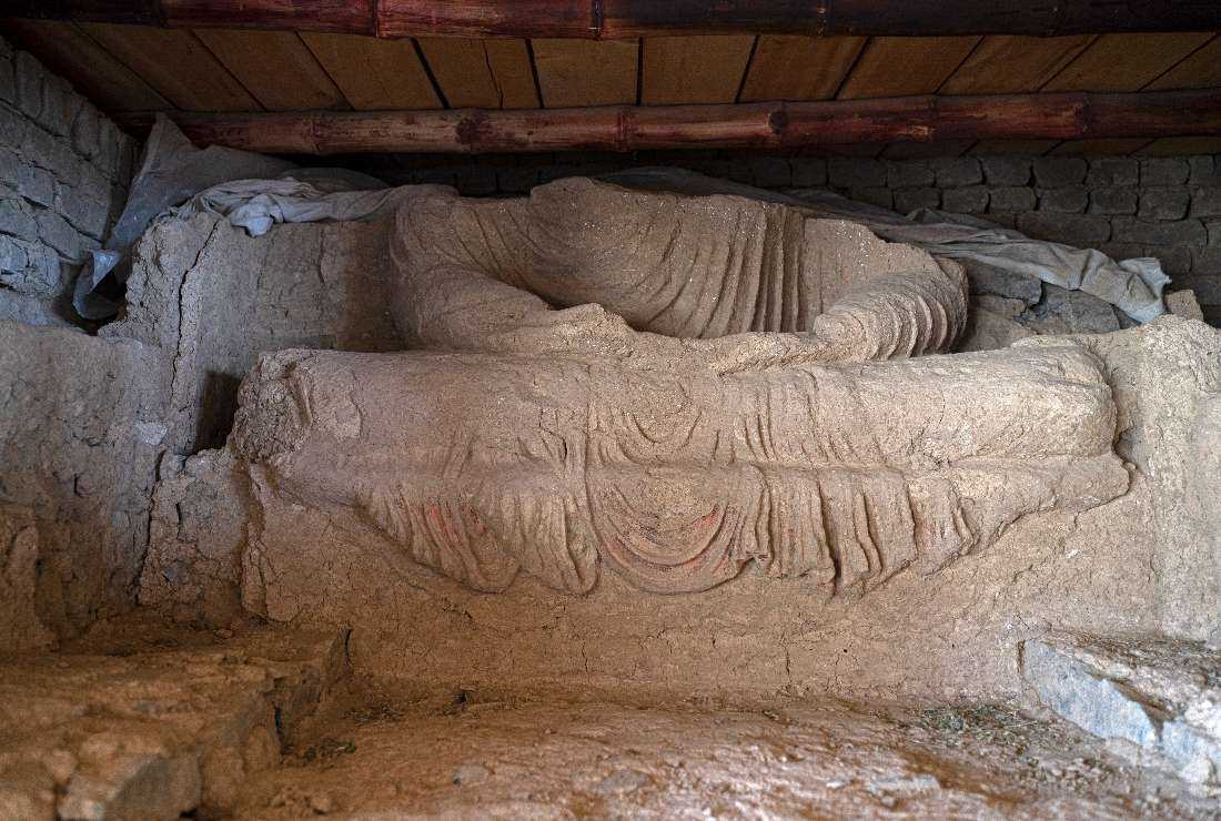 Part of a statue of Buddha after being uncovered at an archeological site in Mes Aynak in Afghanistan's eastern province of Logar on May 17