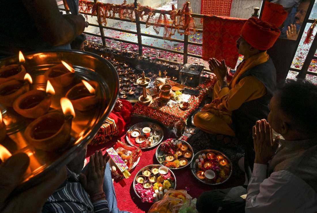 Hindu devotees perform religious rituals during the annual Mela Kheer Bhawani festival at a temple in Tullamulla village on the outskirts of Srinagar