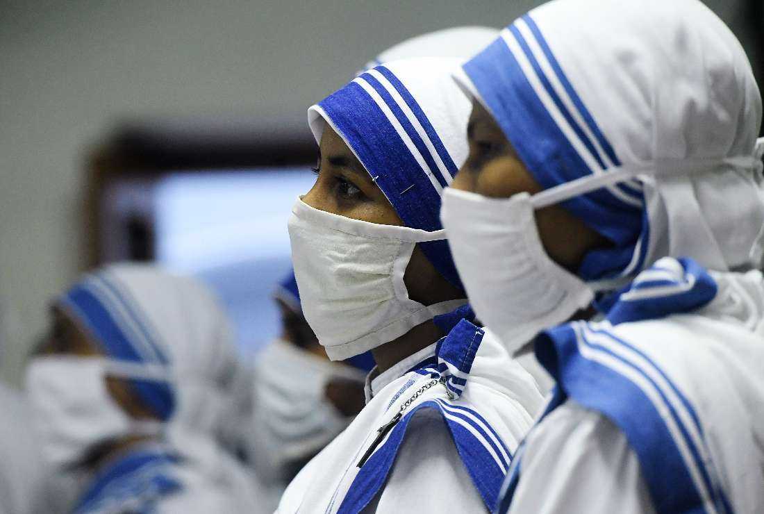 Missionaries of Charity nuns pray at the tomb of Mother Teresa at a service to commemorate her 23rd death anniversary at the congregation's house in Kolkata on Sept. 5, 2020