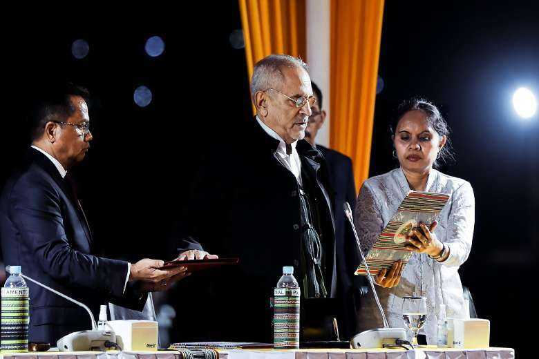 Newly elected President Jose Ramos-Horta reads his oath during his inauguration ceremony in Dili on May 20