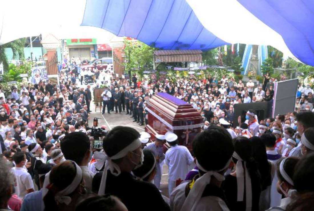 Thousands of people gather to pay their respects to Father Joseph Nguyen Huu Triet at Tan Sa Chau Church in Ho Chi Minh City on June 17