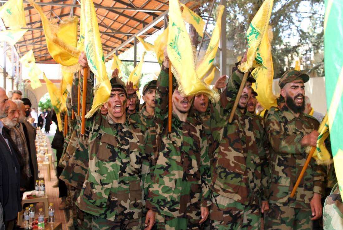 Fighters of the Lebanese Shia movement Hezbollah take part in a parade to mark the 22nd anniversary of the Israeli withdrawal from south Lebanon in Baalbek in the Bekaa Valley on May 25