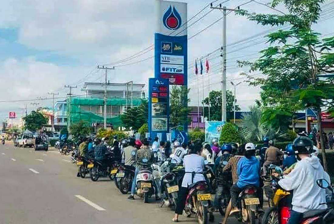 Motorists queue for fuel at a petrol station in Vientiane on May 9