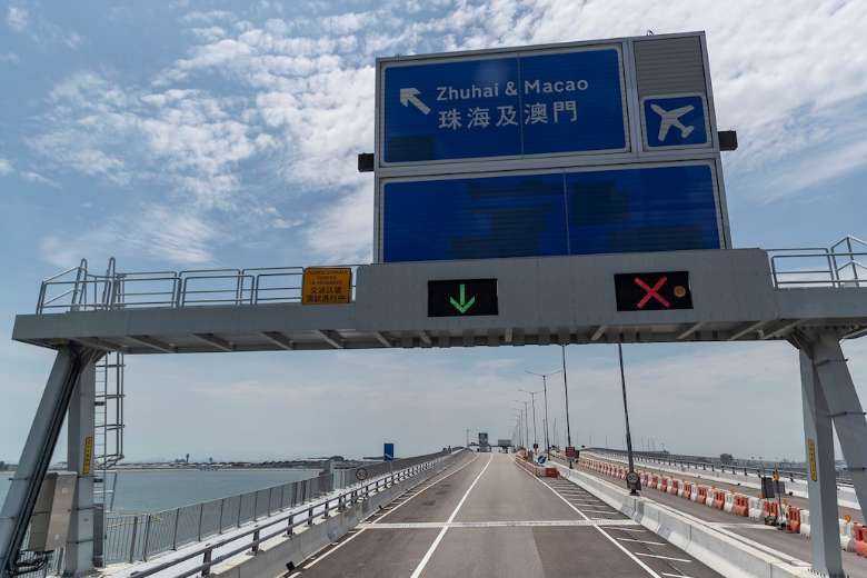A road sign for Macau is seen near the Hong Kong-Zhuhai-Macau Bridge