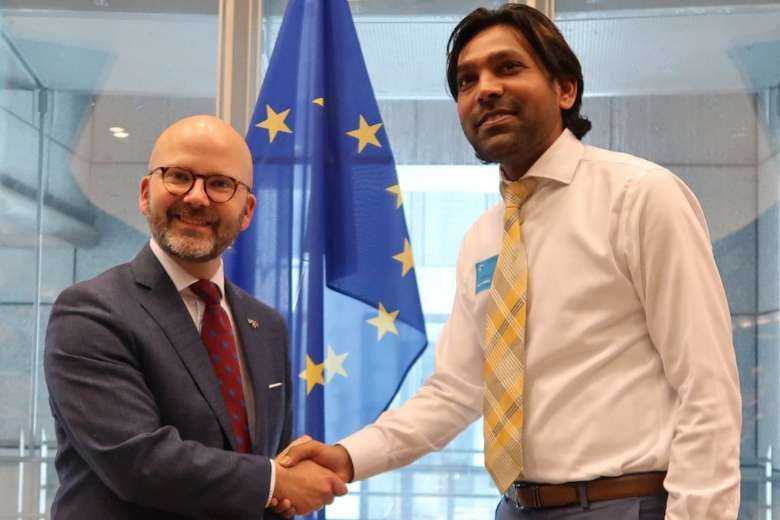 Voice of Justice chairman Joseph Jansen (right) meets with European parliamentarian Charlie Weimers in May at the European Parliament