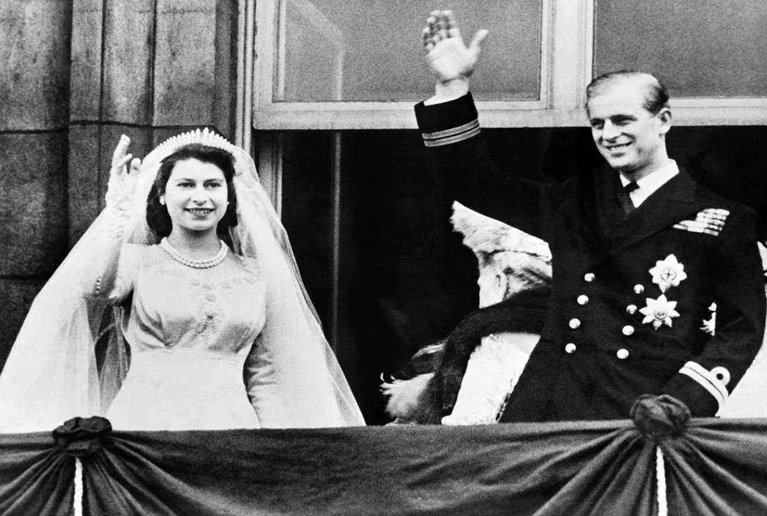 Queen Elizabeth II and Prince Philip, Duke of Edinburgh, wave at their wedding on Nov. 20, 1947, in London