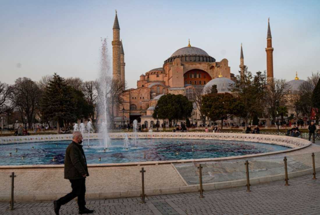 A man walks past the Hagia Sophia in Istanbul, on April 1