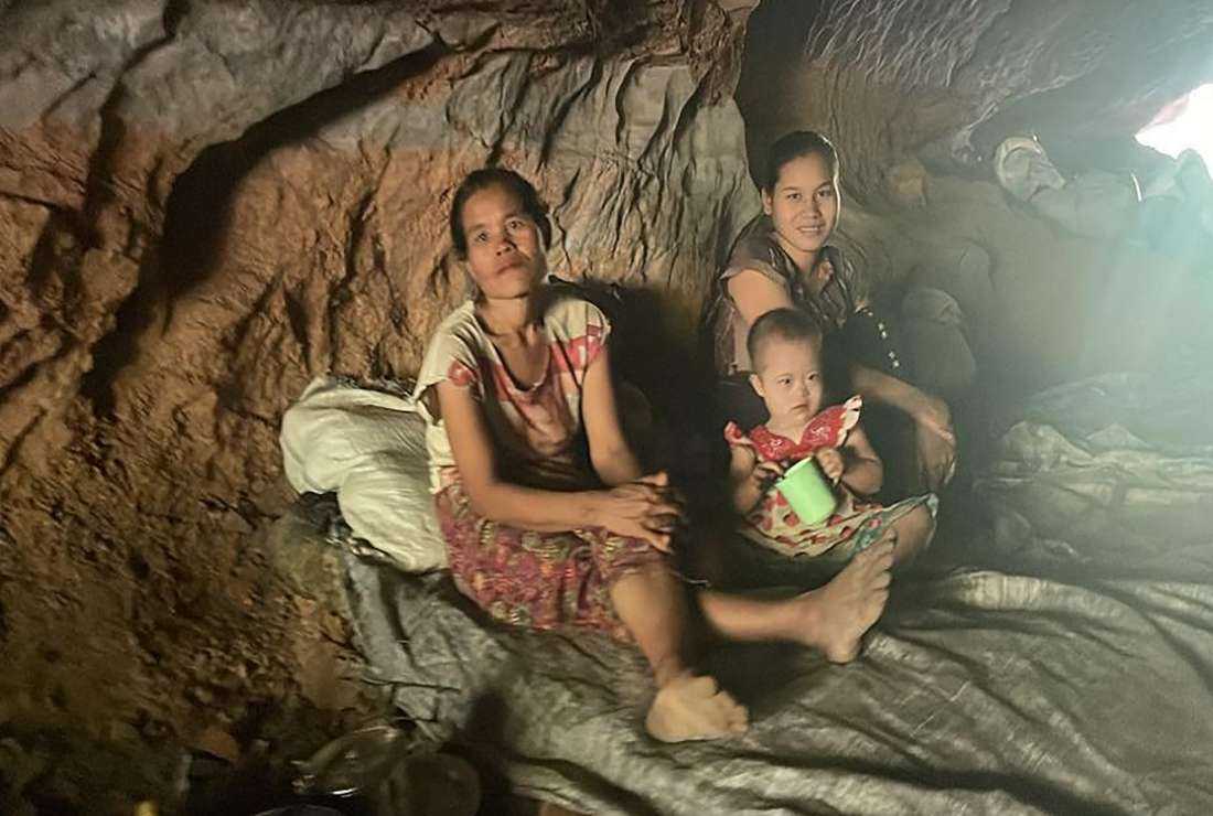 This handout photo from humanitarian group Free Burma Rangers taken on May 3 shows civilians hiding in a cave after military air strikes and mortar attacks on their village in eastern Karen state