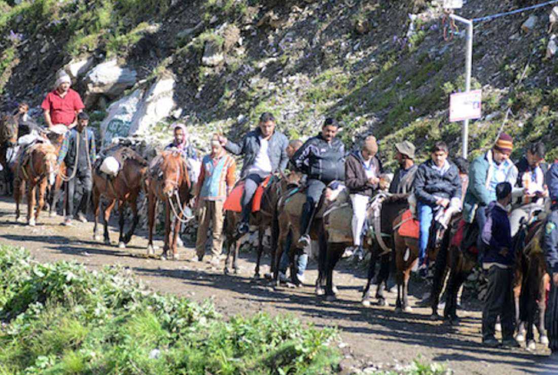 Muslim horsemen assist Hindu travelers along the Amarnath Yatra pilgrimage route in Jammu and Kashmir