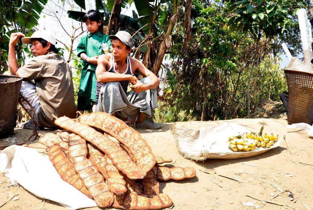 Ethnic tribal people sell their produce at a roadside market in the Chittagong Hill Tracts of Bangladesh