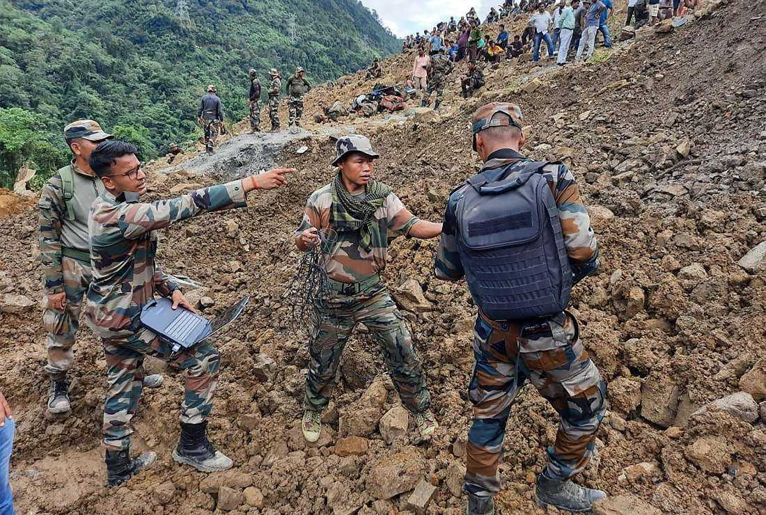 Indian army and disaster relief teams search for survivors and victims after a landslide in the northeastern state of Manipur, in India, on July 2