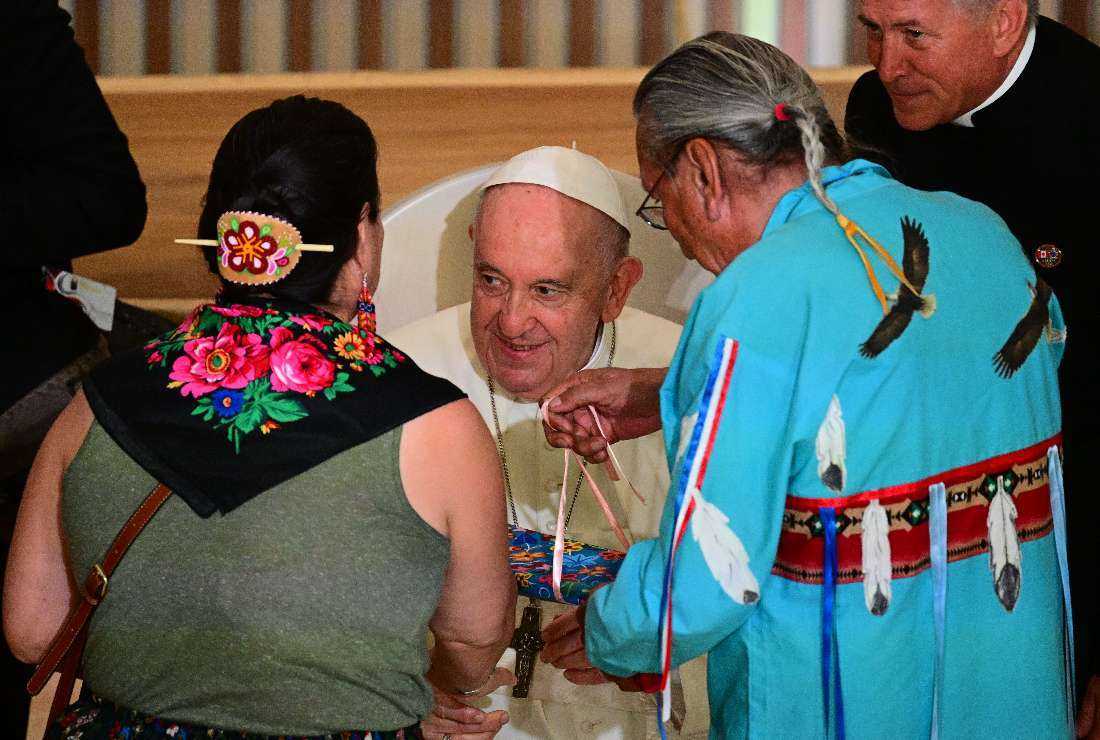 Pope Francis recieves gifts from members of the Indigenous community at the Sacred Heart Church of the First Peoples in Edmonton, Alberta, Canada, on July 25