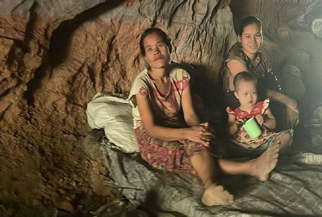 This handout photo from the humanitarian group Free Burma Rangers taken on May 3, 2022 and released on May 4 shows civilians hiding in a cave after airstrikes and mortar attack on their village by the Myanmar military